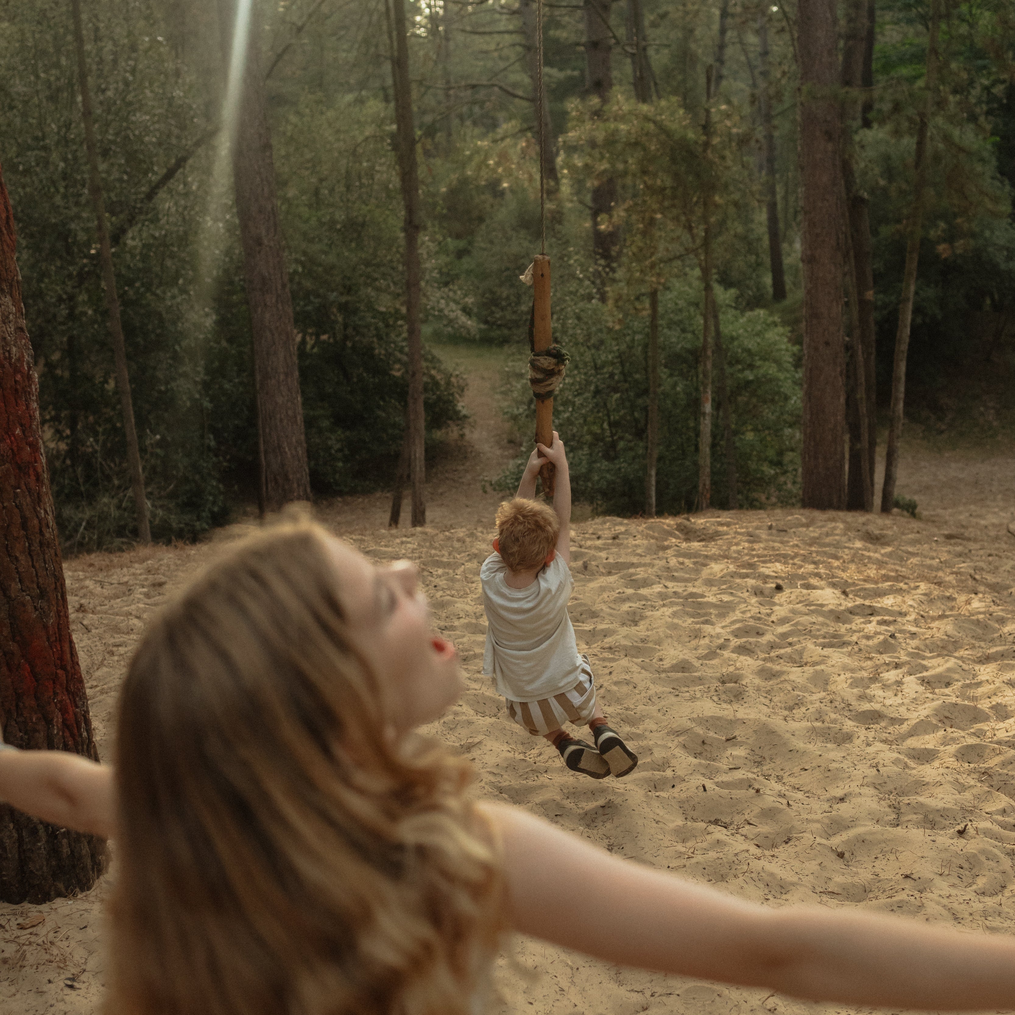 Girl having fun and feeling free in the woods