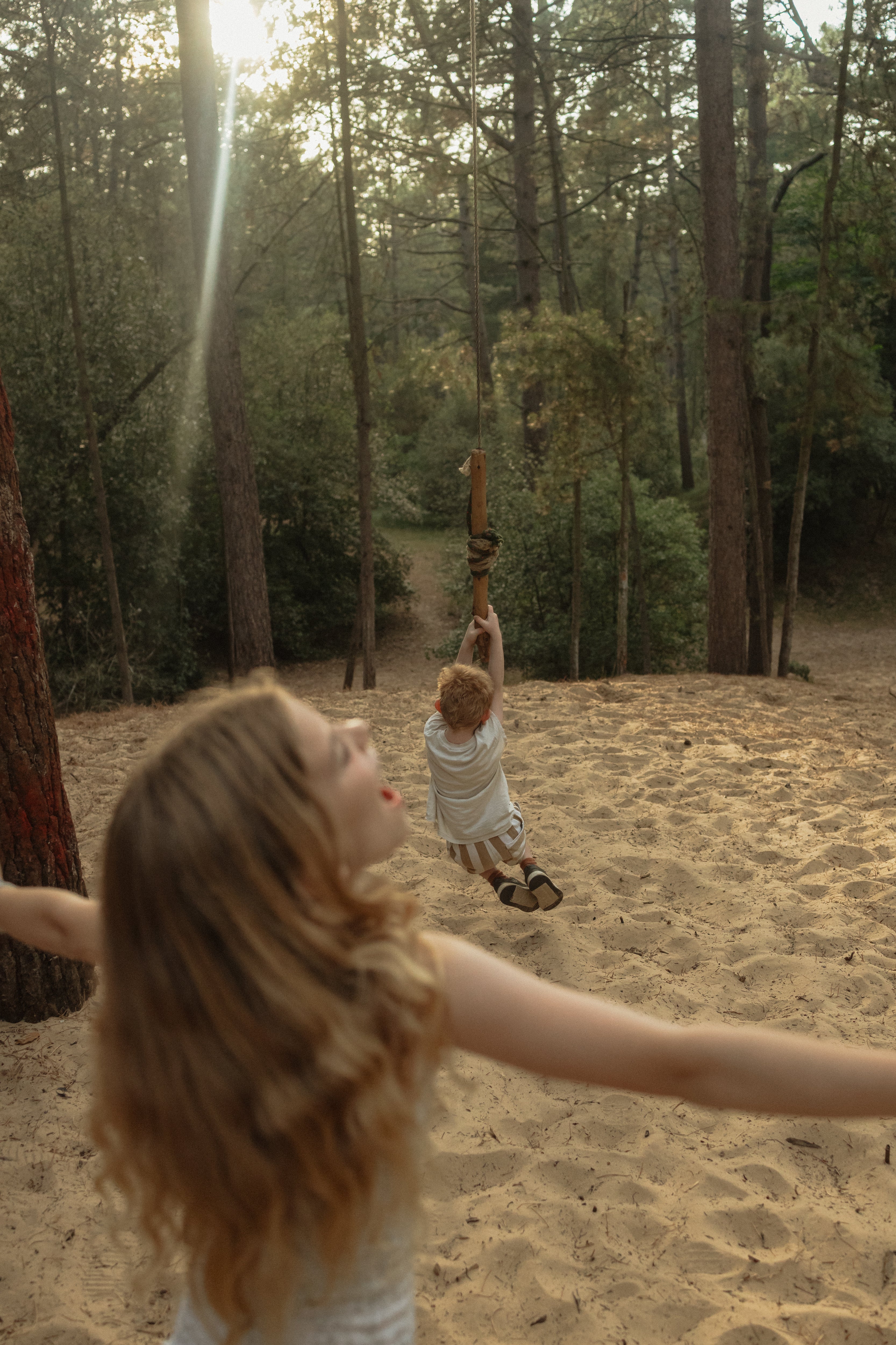 Girl having fun and feeling free in the woods