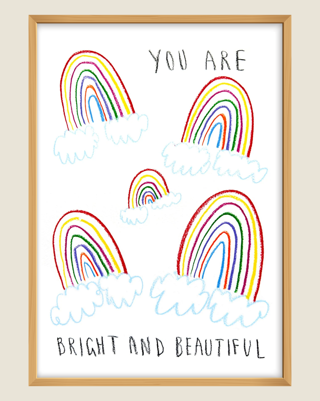 Framed artwork with rainbows and positive message on a white background