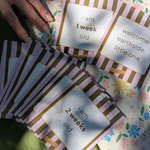 Celebrating baby's firsts with milestone cards in dappled sunshine